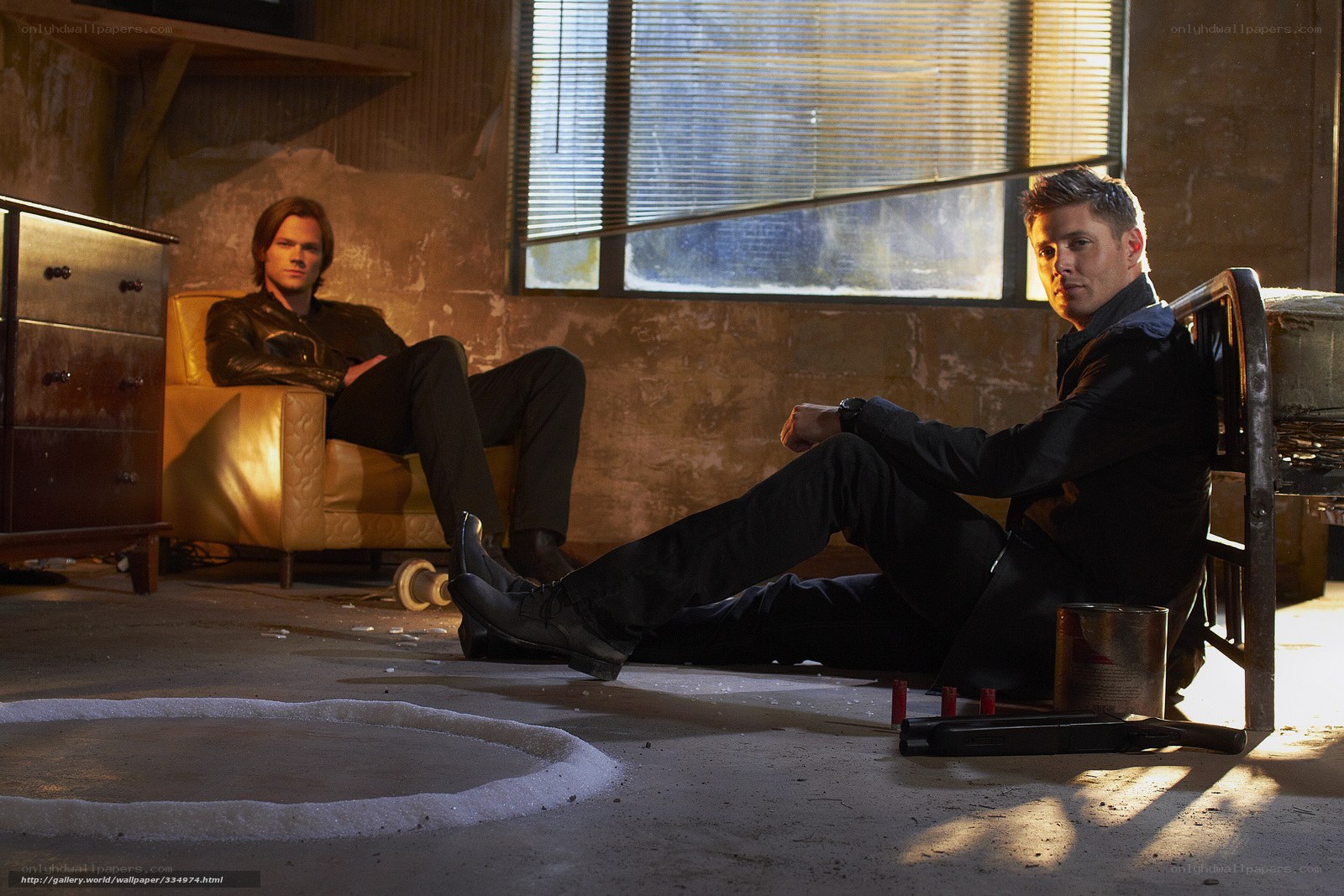 two men in a dimly lit room