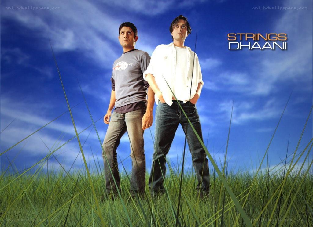 Two men in a field with text