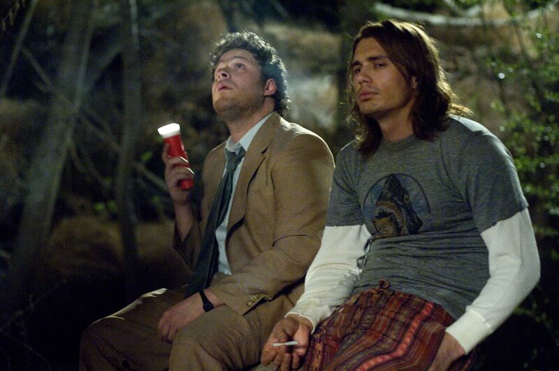 Two men in a forest at night