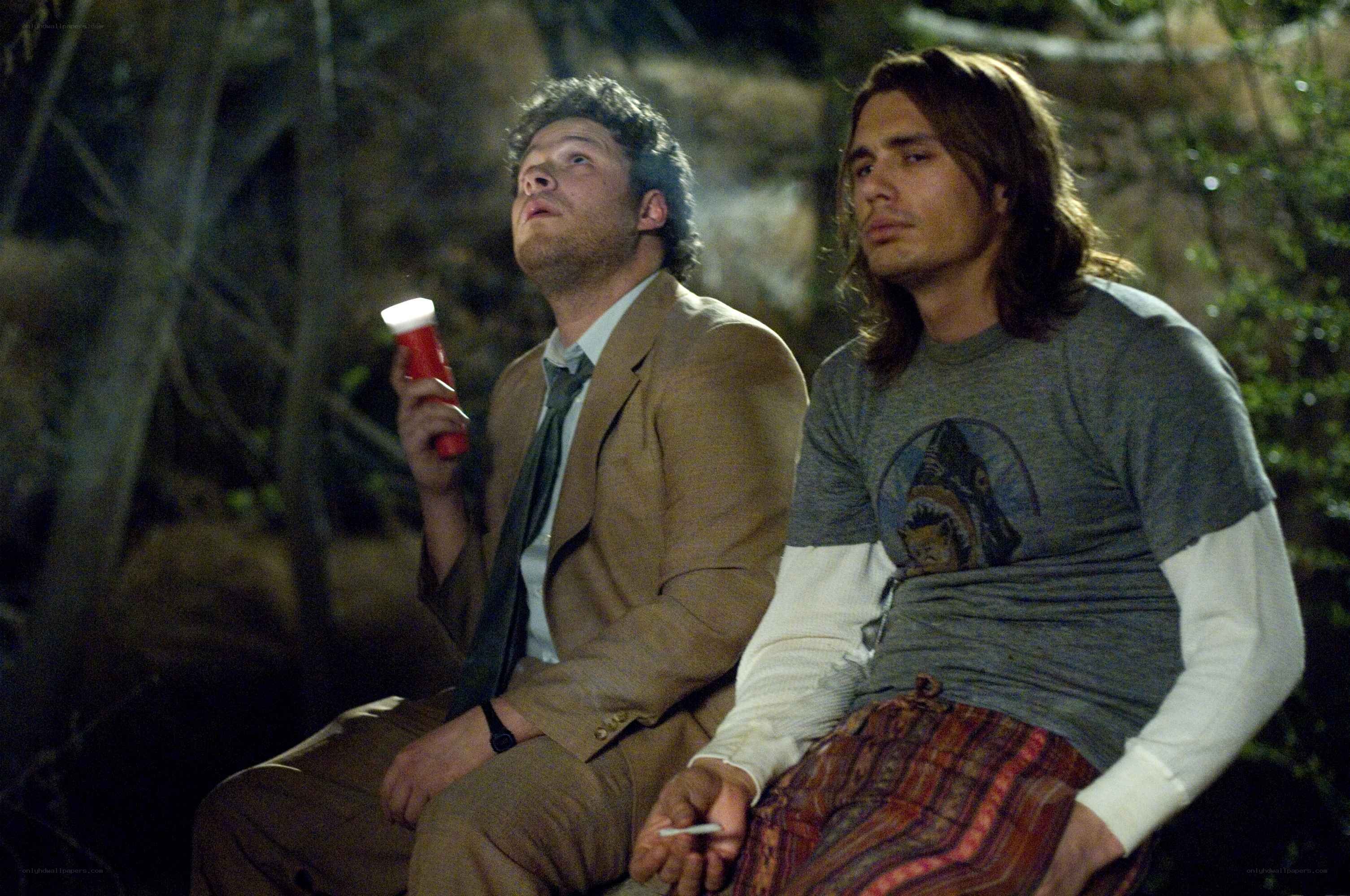 Two men in a forest at night