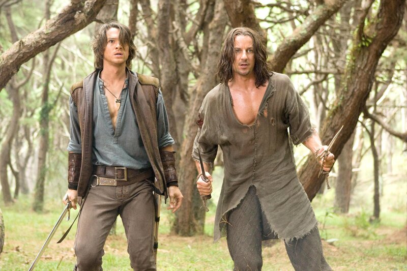 Two men in a forest with swords