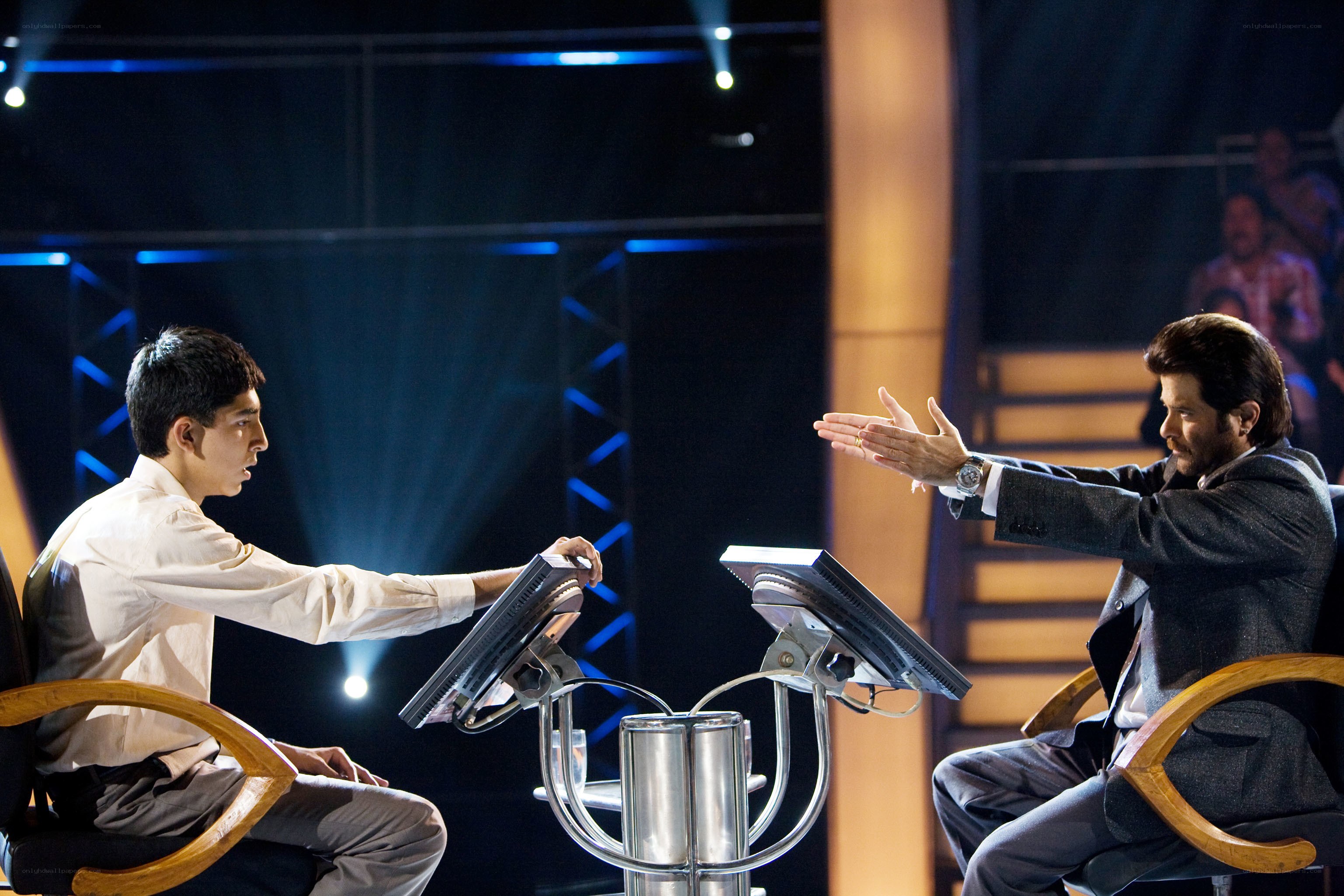 Two men in a game show debate