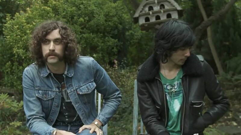 two men in a garden