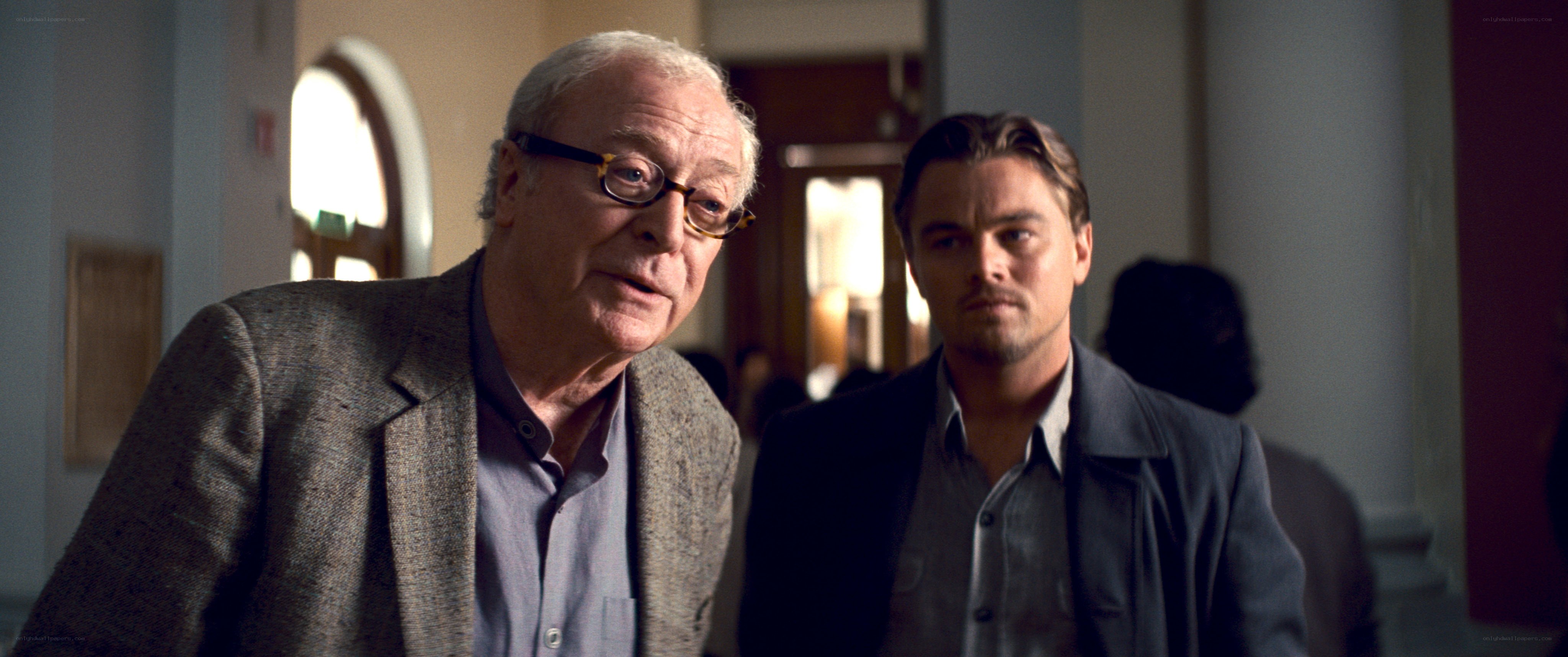 Two men in a hallway scene