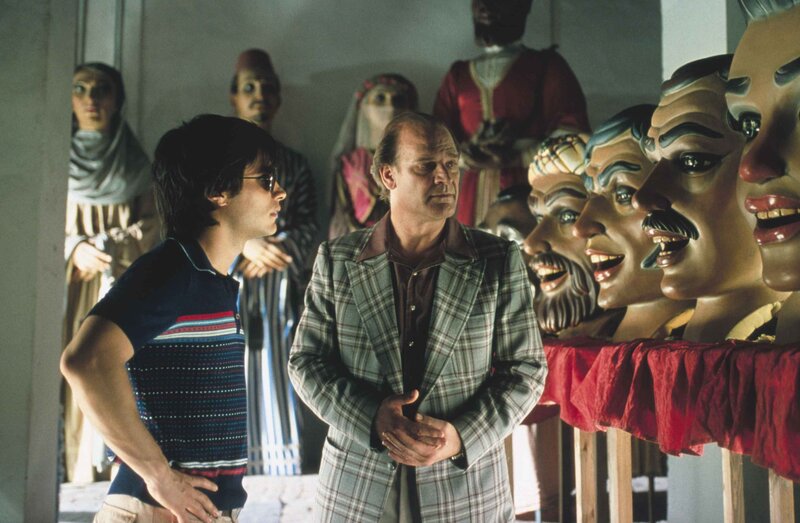 Two men in a puppet shop