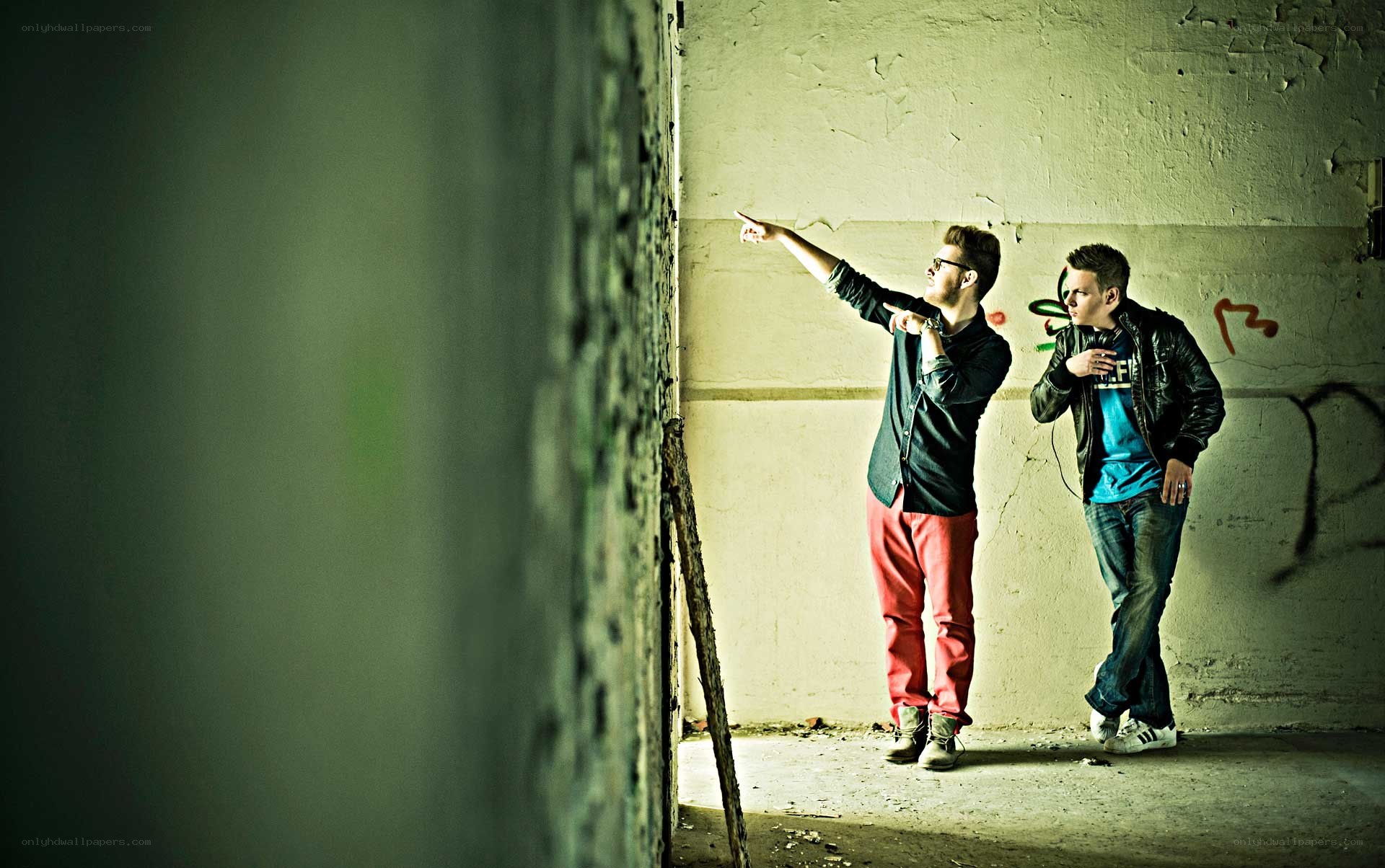 two men in an abandoned building