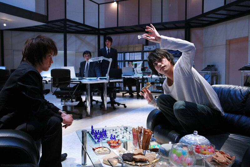 Two men in an office with chess set