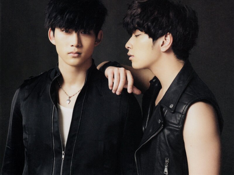 two men in black leather jackets