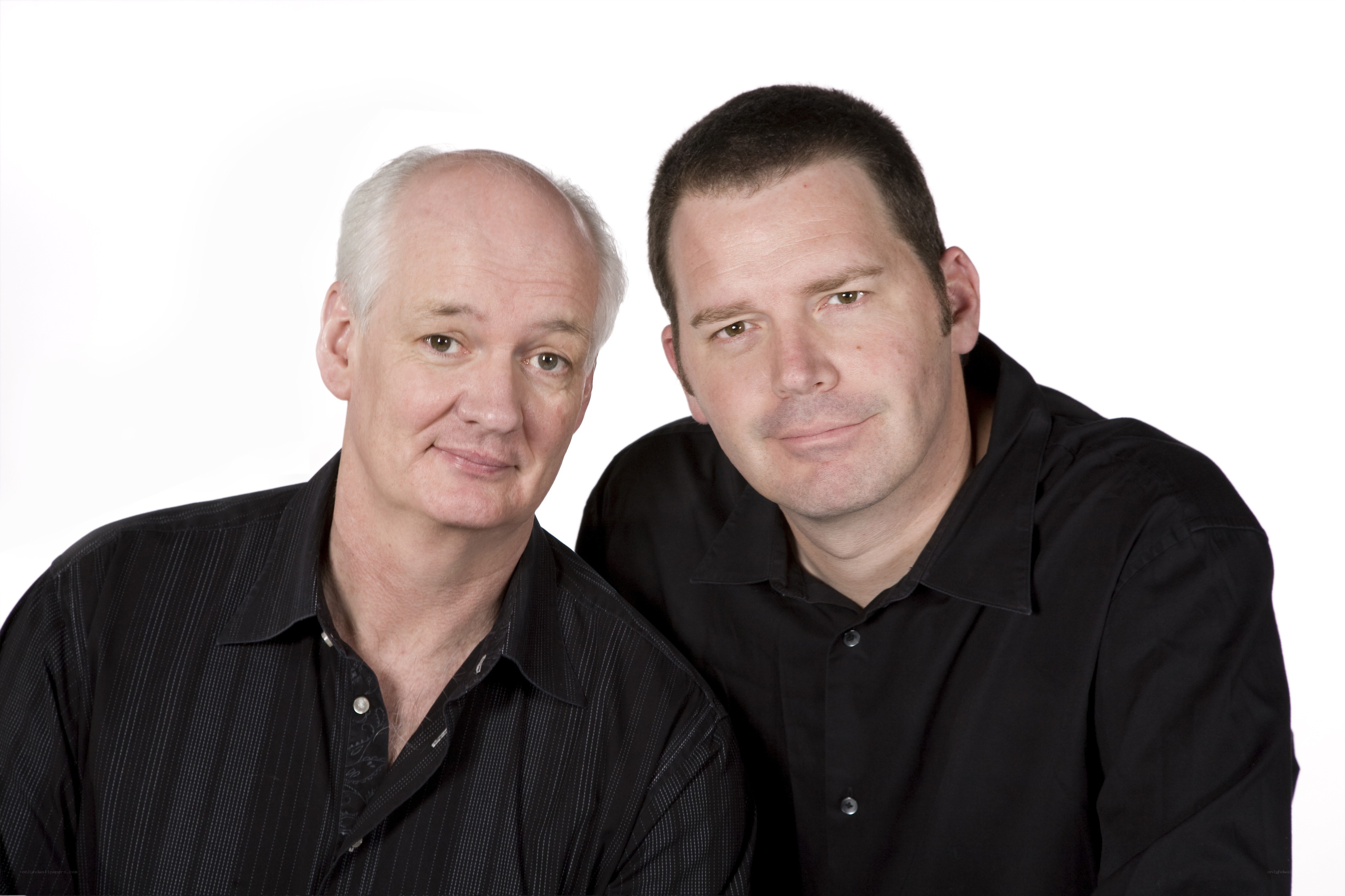 two men in black shirts