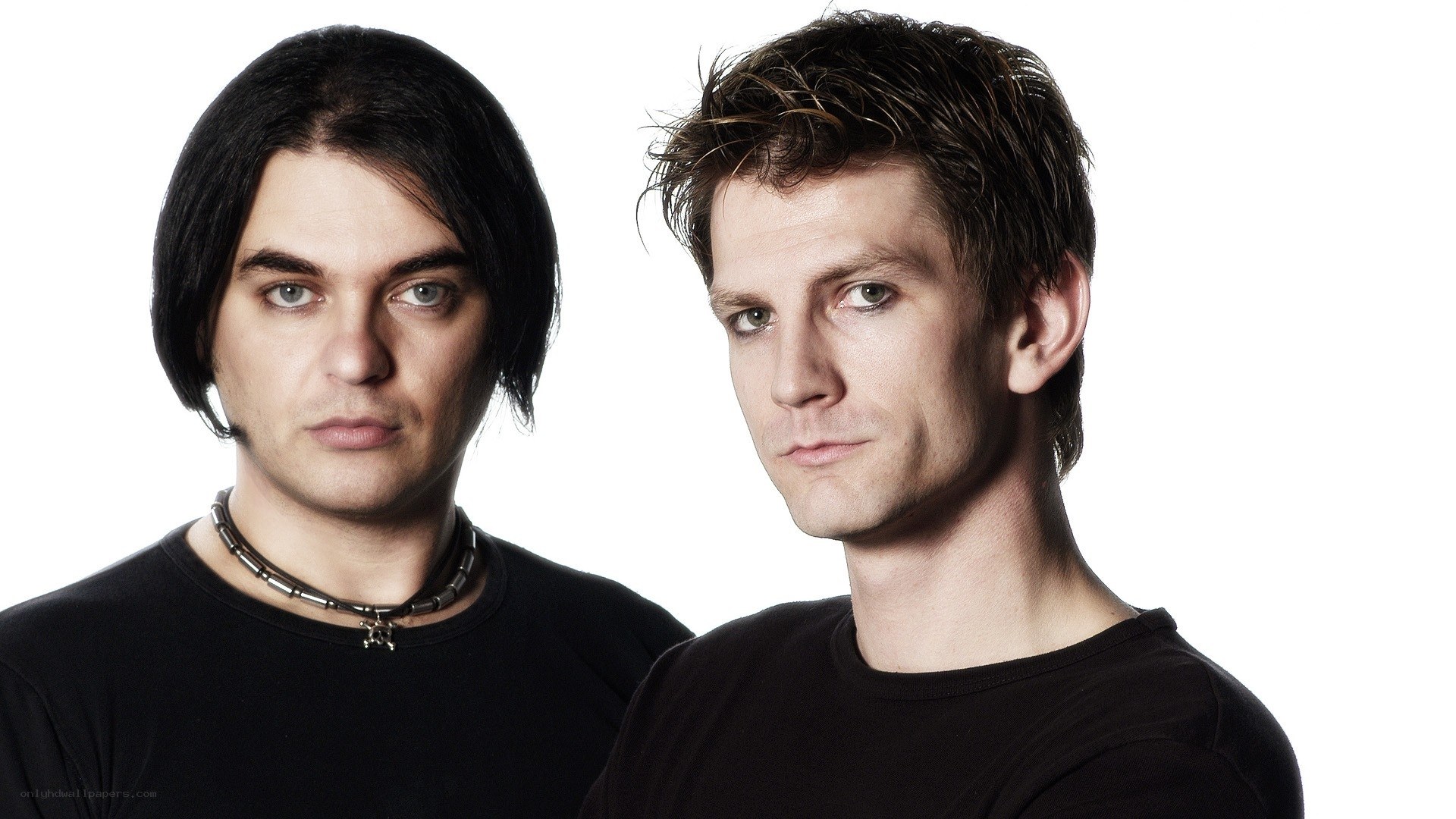 two men in black shirts
