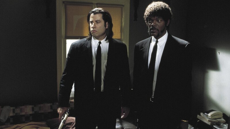 two men in black suits