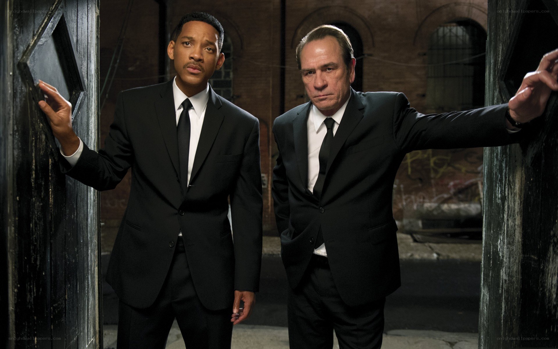 two men in black suits