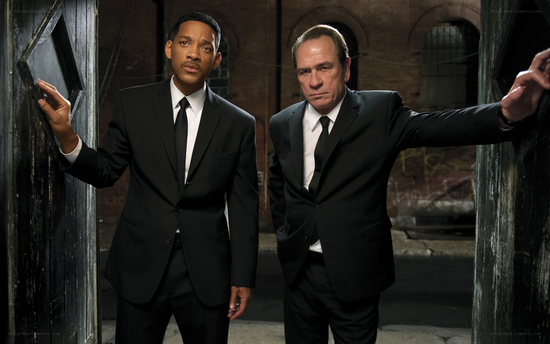 two men in black suits
