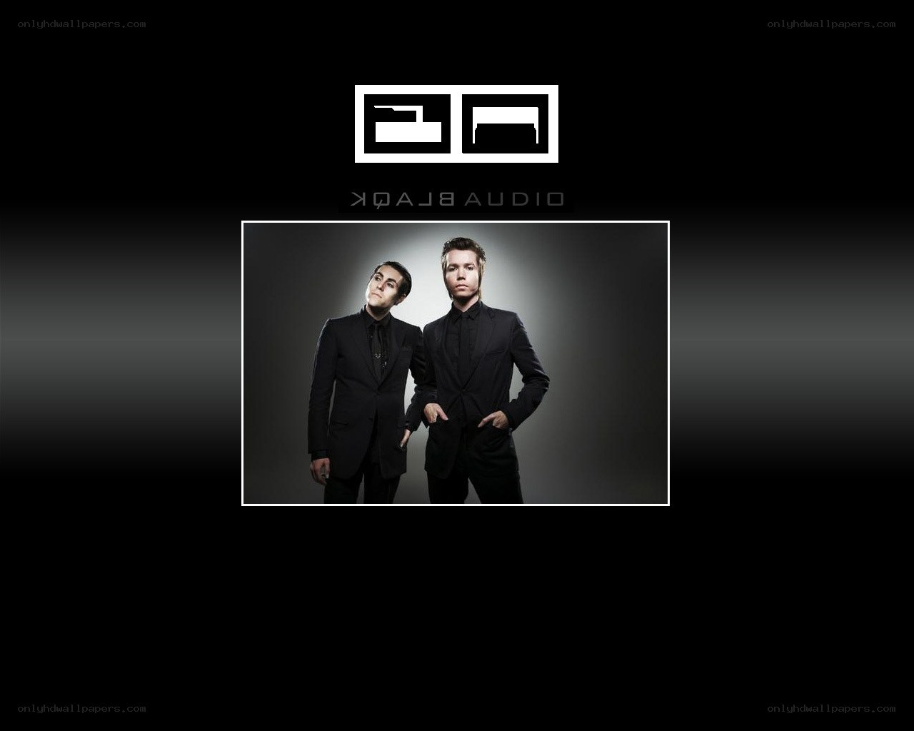 two men in black suits