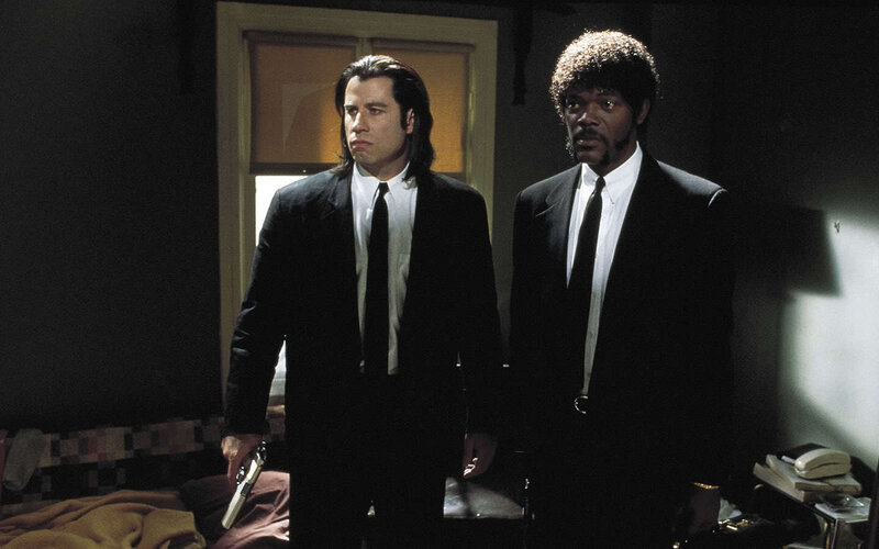 two men in black suits