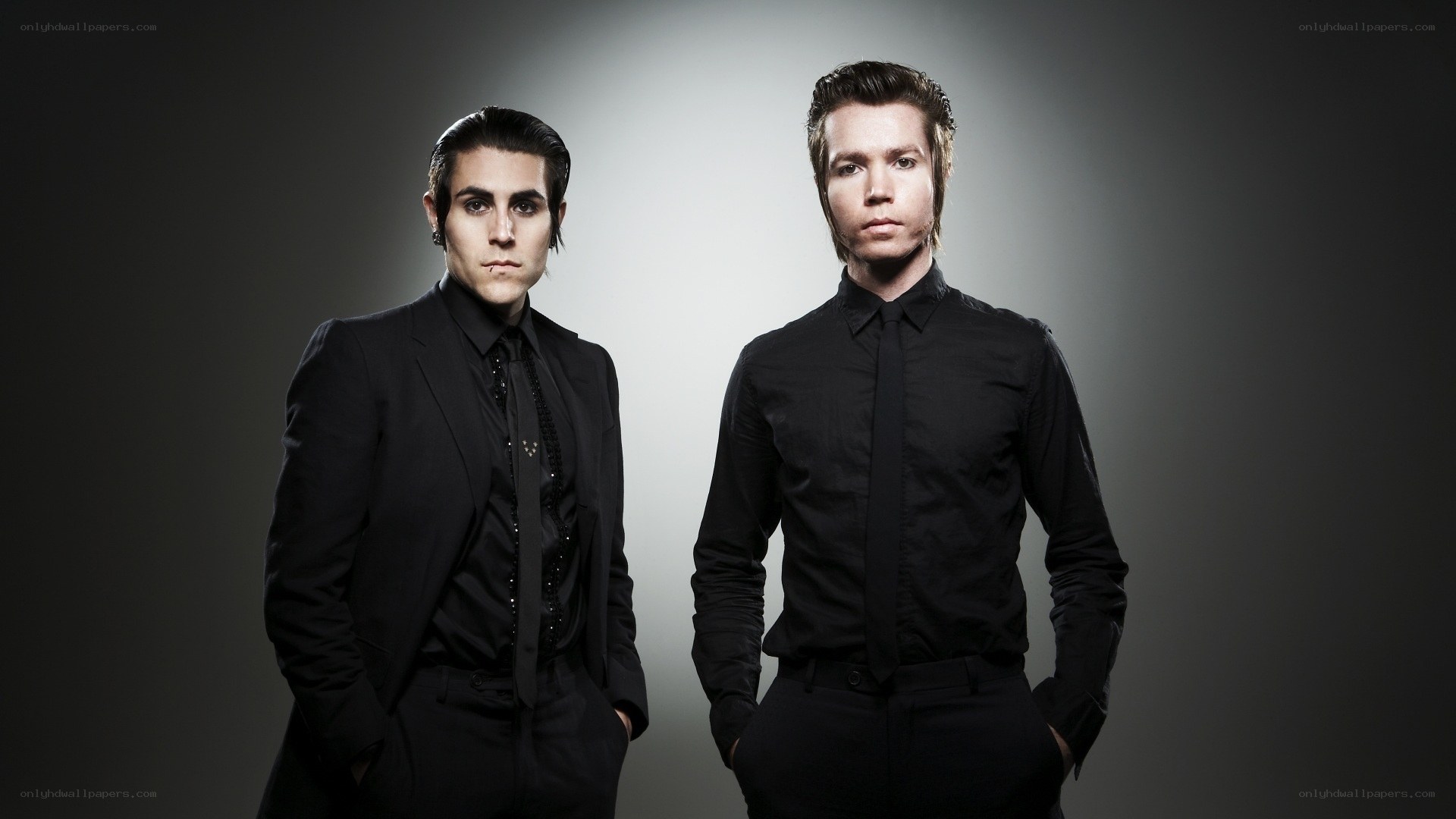 two men in black suits