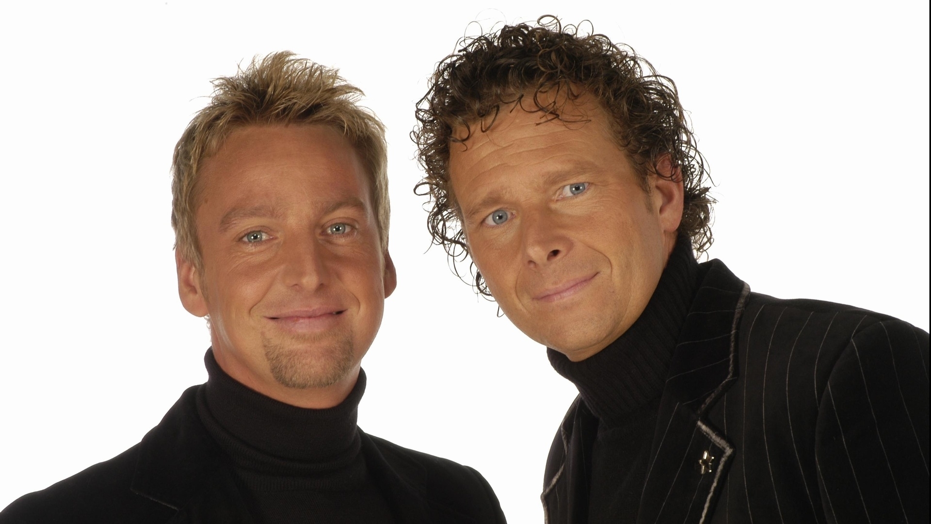 two men in black turtlenecks