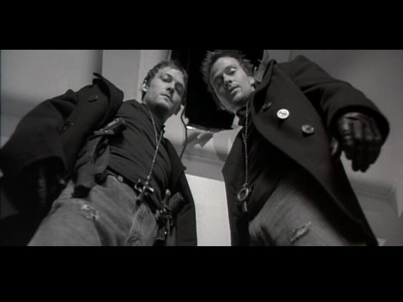 Two men in coats lying down