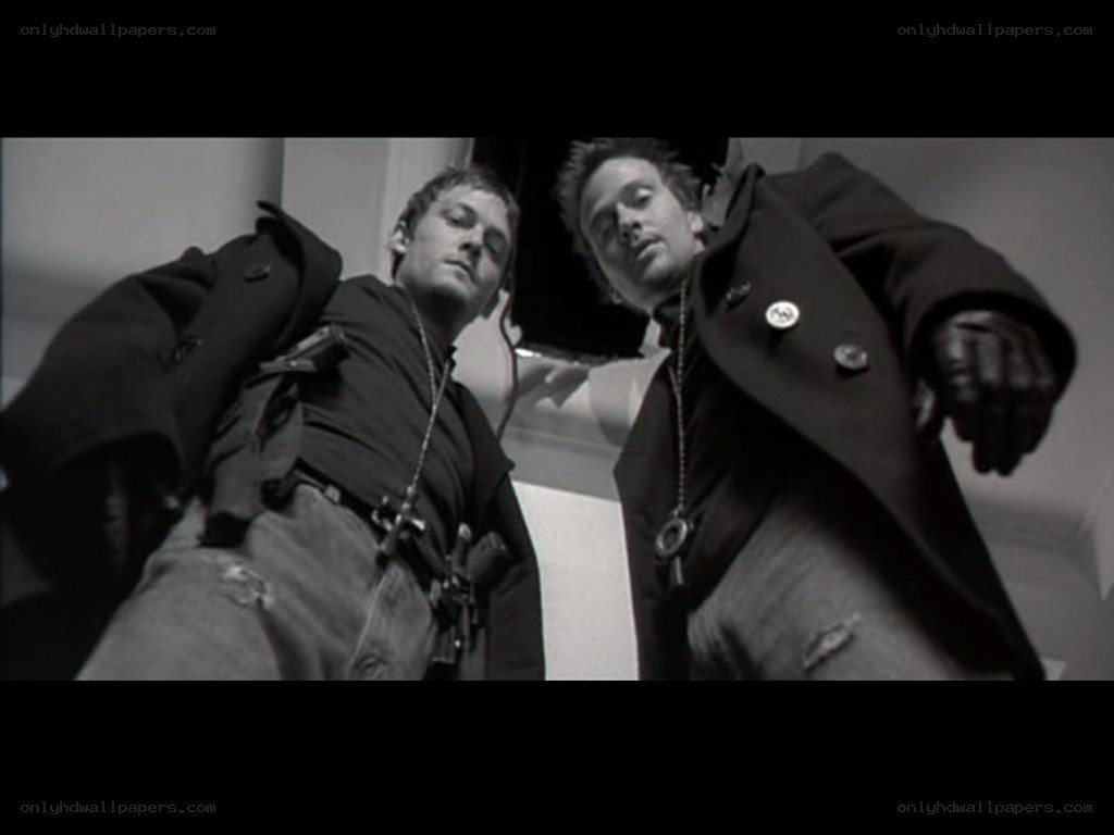 Two men in coats lying down