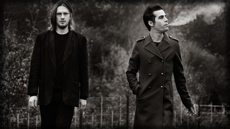 two men in coats walking