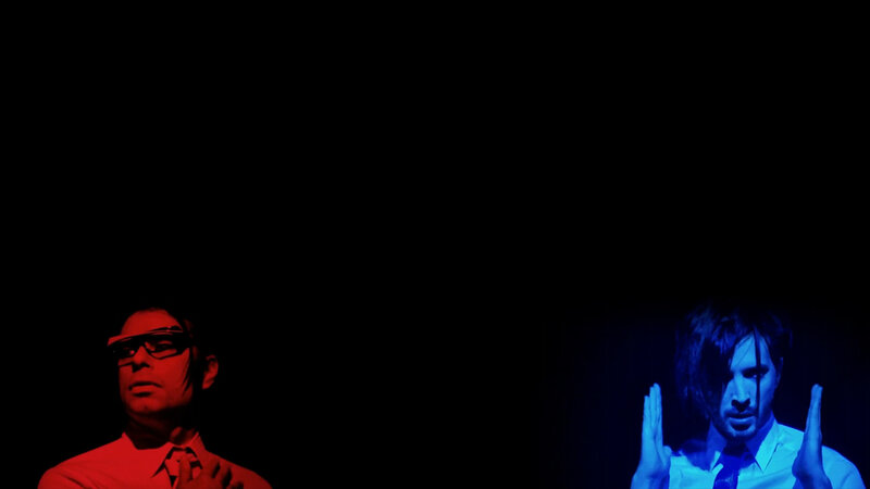 two men in colored light