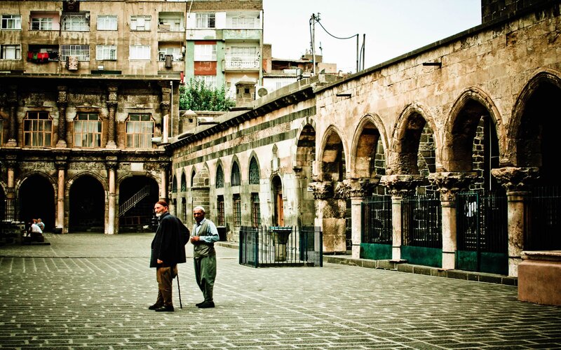Two Men in Courtyard