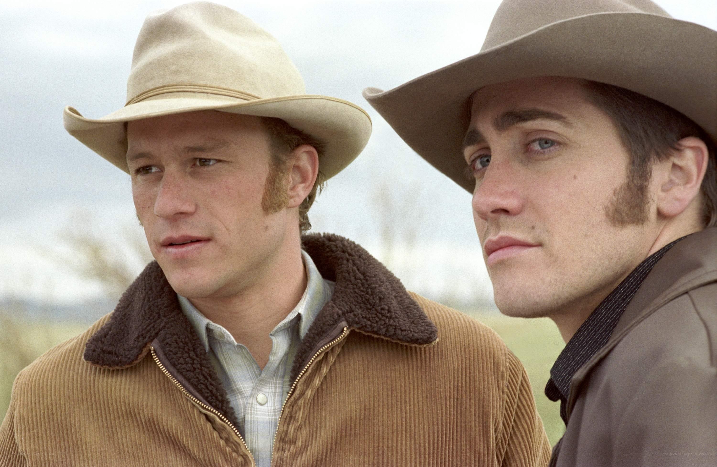 two men in cowboy hats