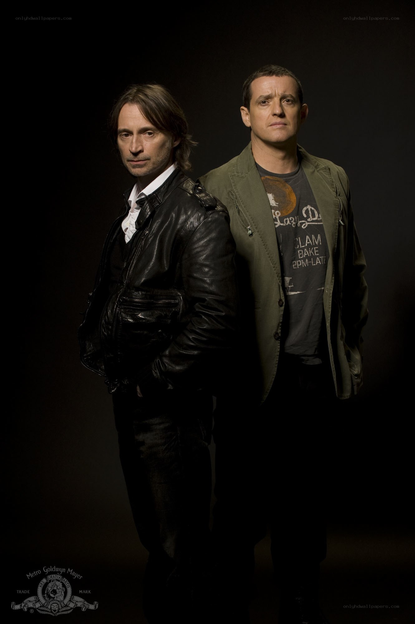 two men in dark clothing