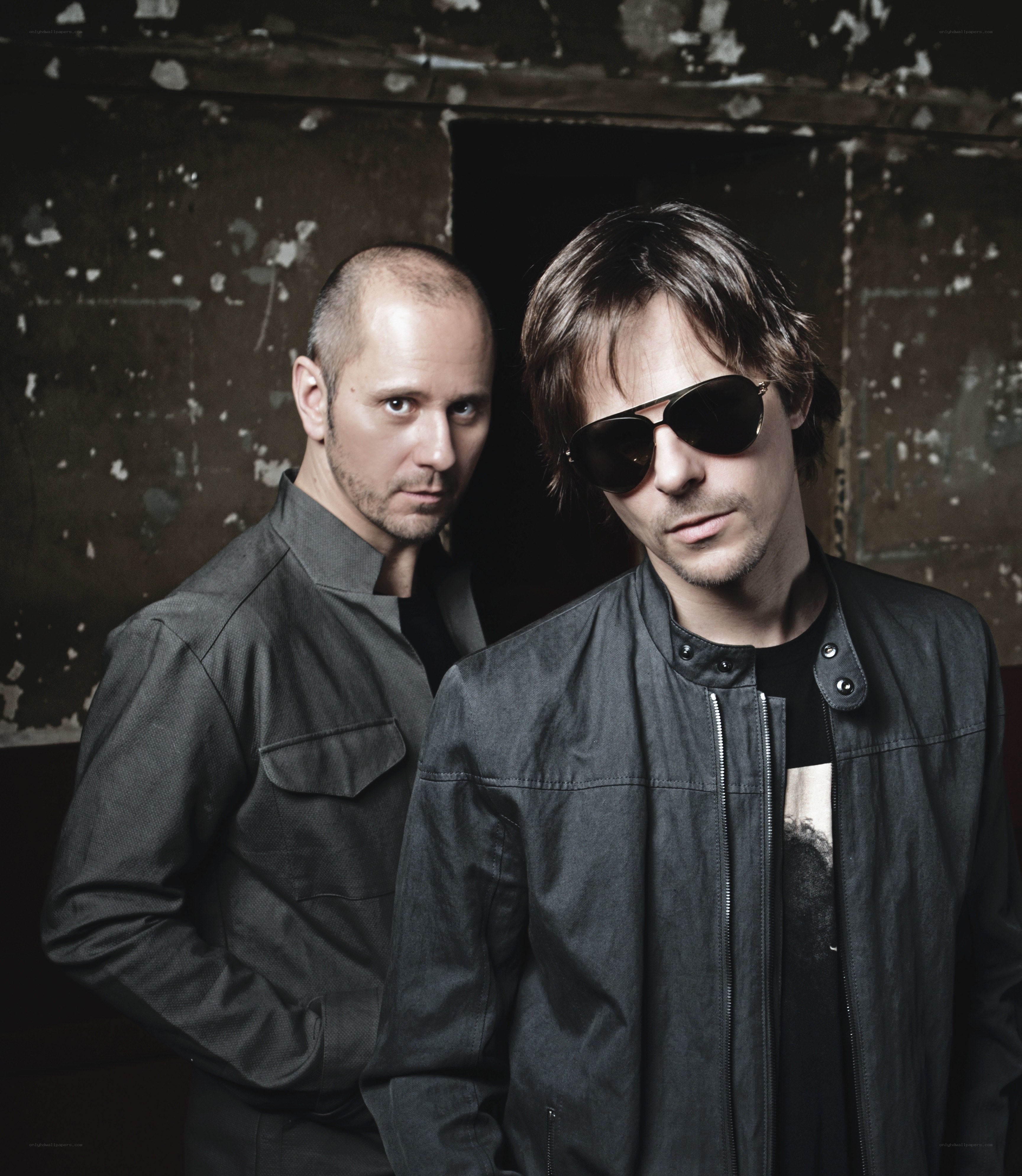 two men in dark clothing