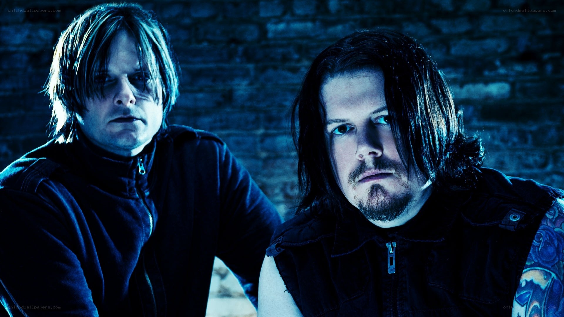 two men in dark clothing