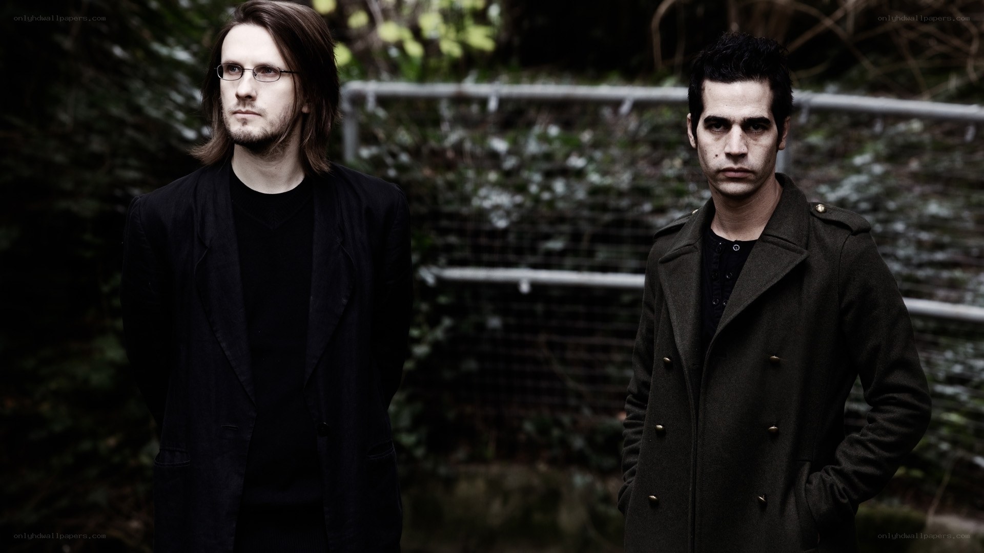 two men in dark coats