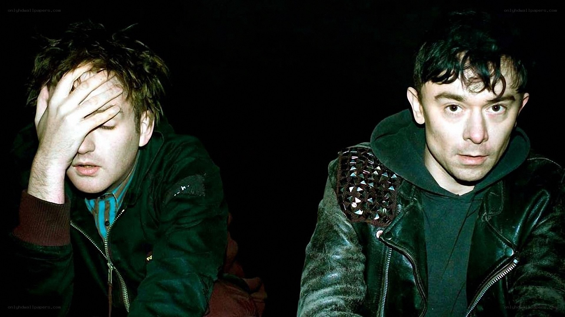 two men in dark jackets