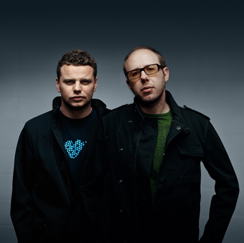 two men in dark jackets