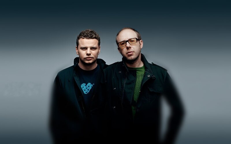 two men in dark jackets