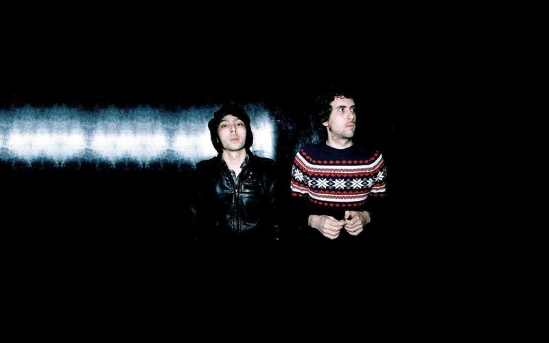 two men in dark setting