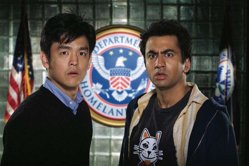 Two men in front of DHS seal