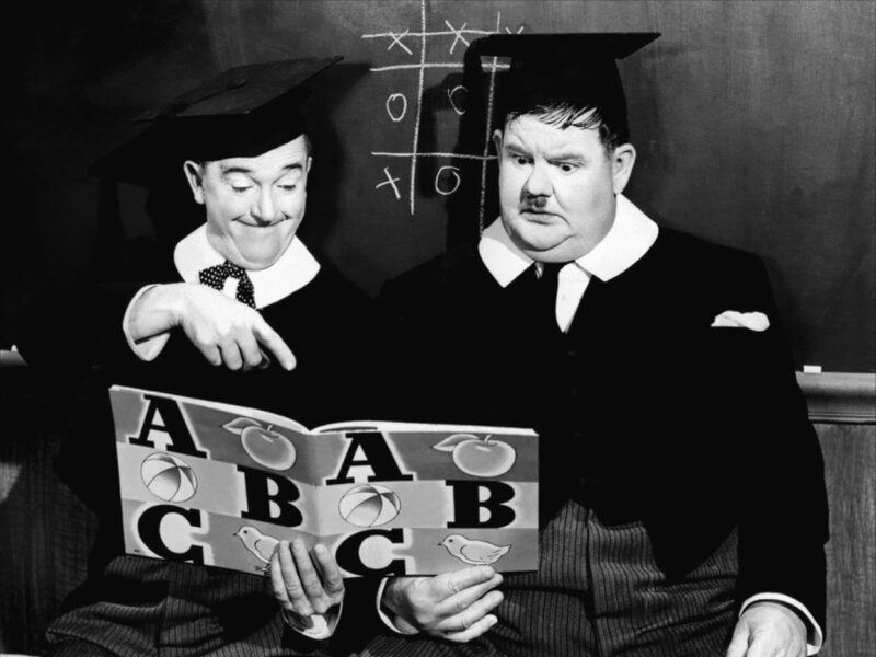 Two men in graduation caps