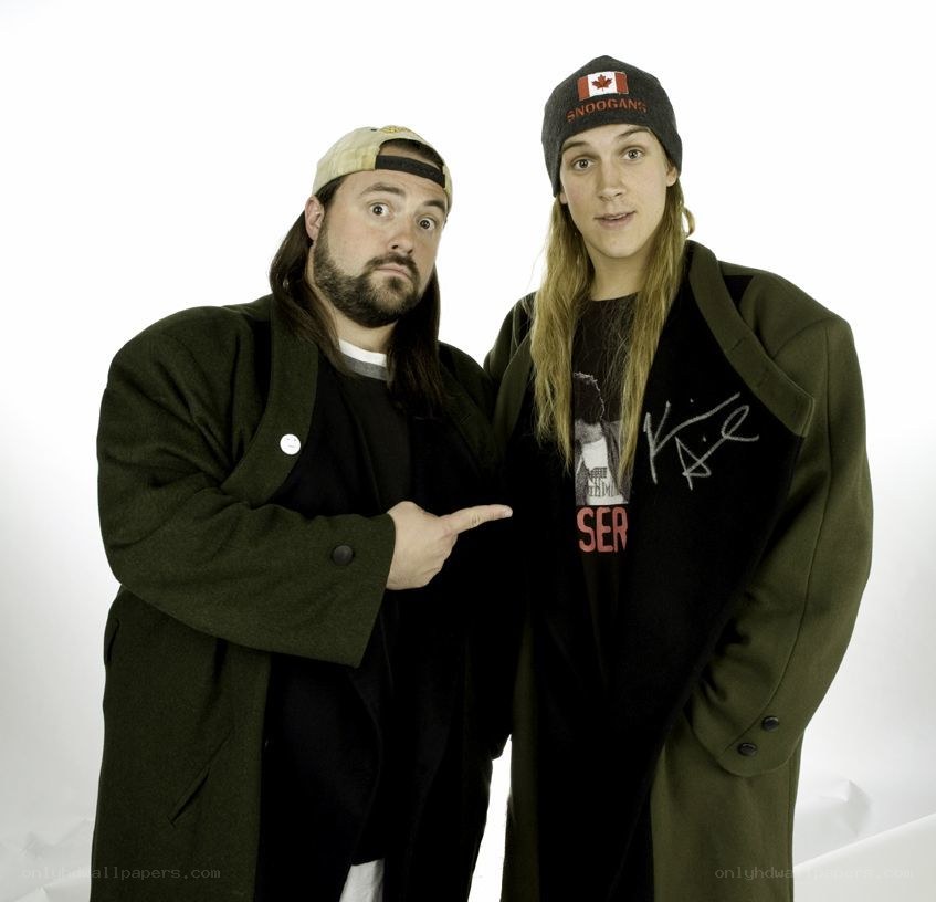 Two men in green coats