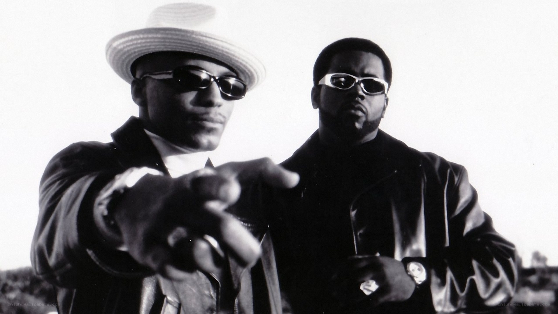 two men in hats and sunglasses