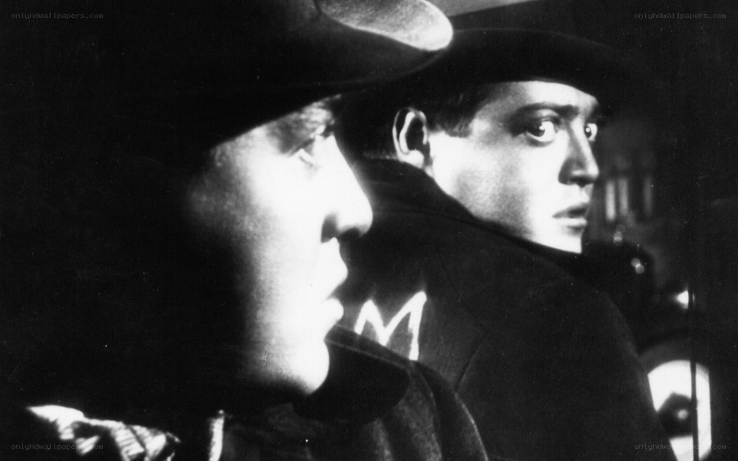 Two men in hats looking off-screen