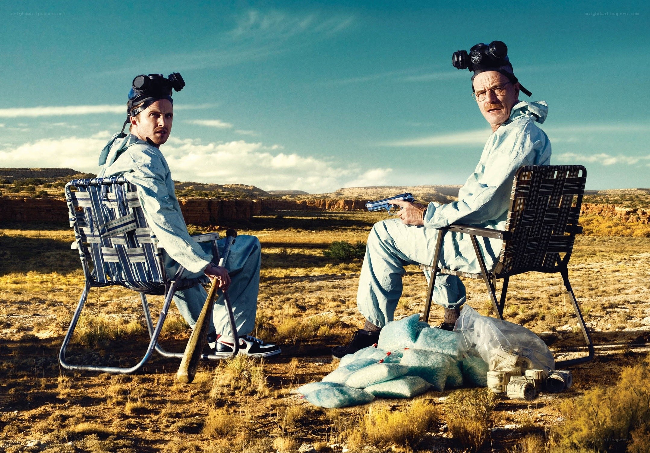 Two men in hazmat suits in desert