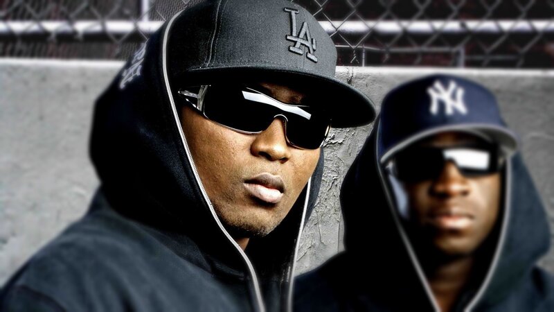 two men in hoodies and caps