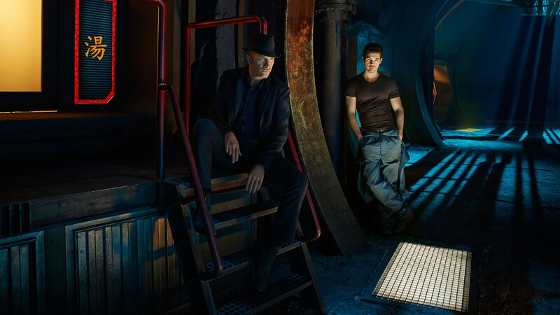 Two Men in Industrial Setting — Blue