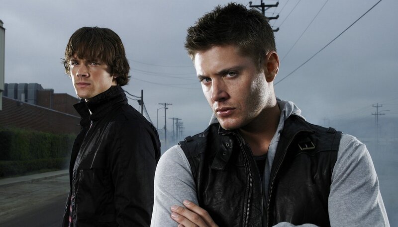 two men in leather vests