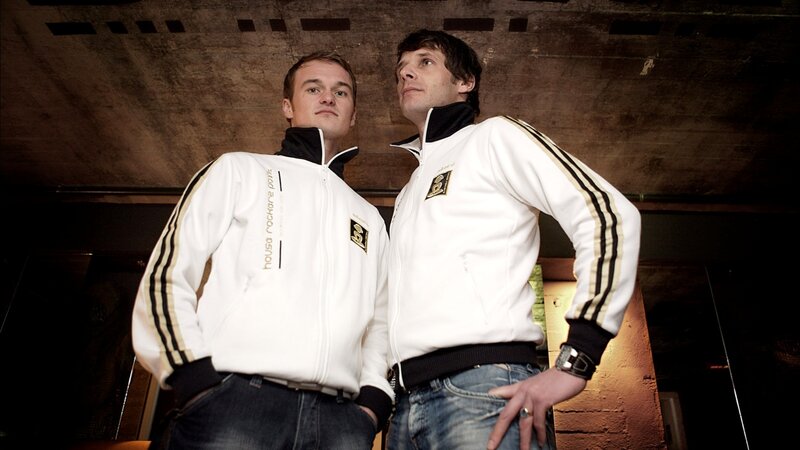 Two men in matching tracksuits