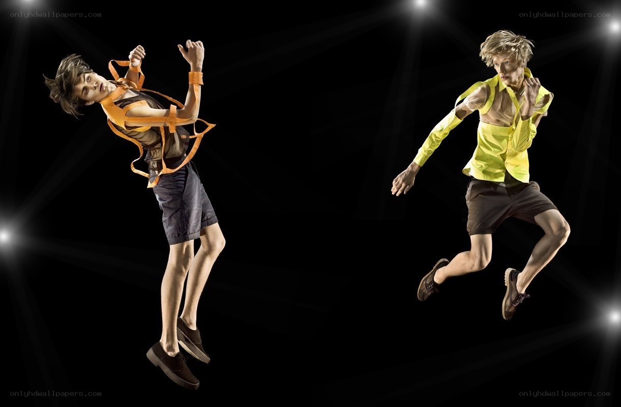 Two men in mid-air jump