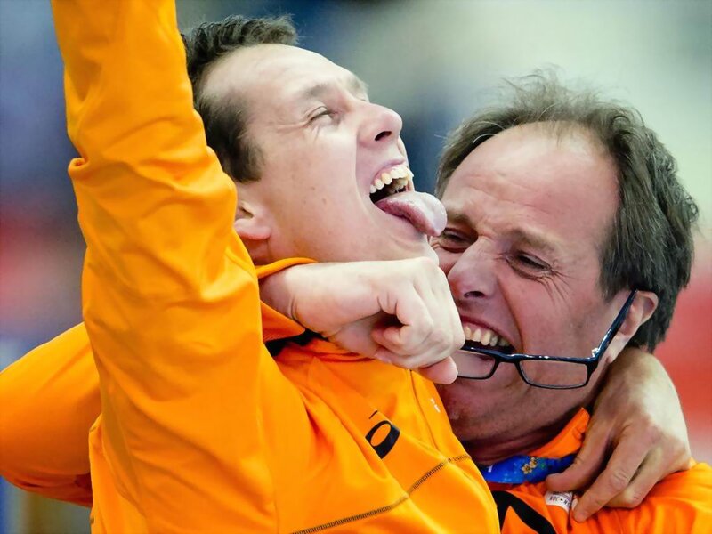 Two Men in Orange Jackets