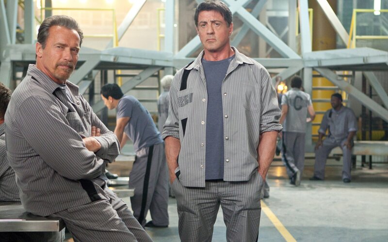Two Men in Prison Uniforms — Gray, Serious