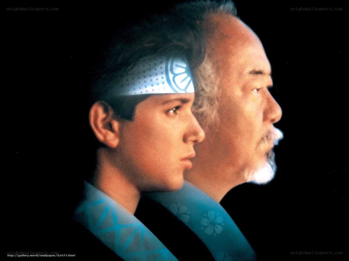 Two men in profile with headbands