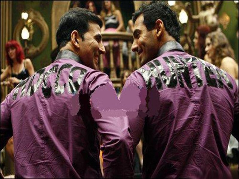 Two Men in Purple Jackets